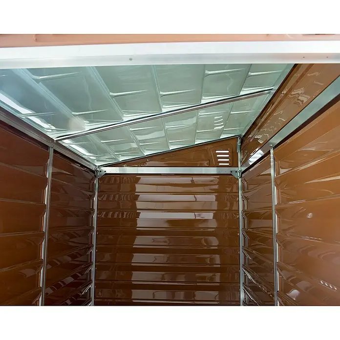 Palram – Canopia Caseta de jardín Skylight - Medidas ext. (An x Pr): 117 x 176 cm, Plástico, Ámbar - Vista interior de un cobertizo de jardín marrón con techo translúcido y textura de pared horizontal.