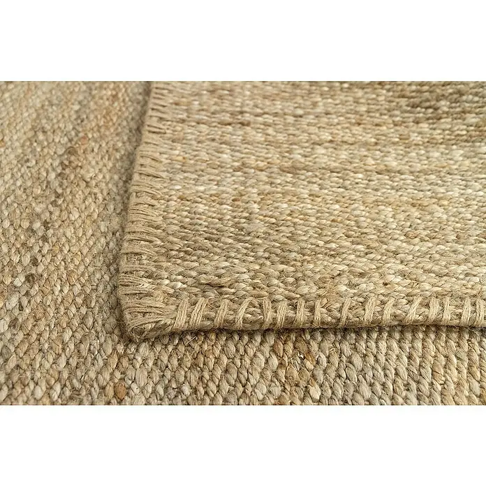 Alfombra de yute Córdoba - Natural, 230 x 160 cm, 100% yute - Primer plano de una alfombra de yute artesanal, que muestra su textura natural y su meticulosa elaboración.