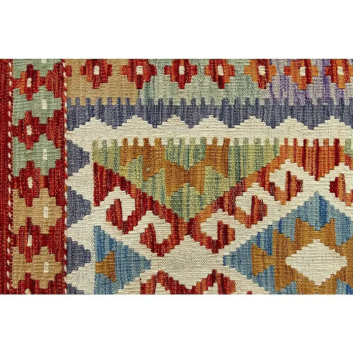 Alfombra de pelo corto Kilim Herat - Multicolor, 150 x 100 cm, 100% lana - Primer plano de una alfombra tejida a mano con patrones geométricos en tonos rojos, azules y tierra. Diseño único para espacios de vida elegantes.