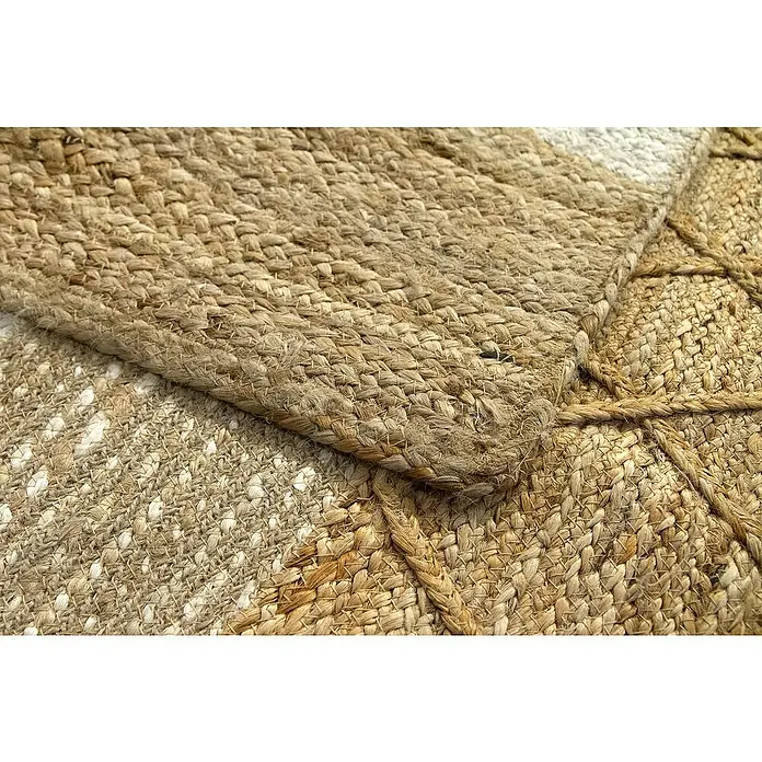 Alfombra de yute París - Natural, 230 x 160 cm, 100% yute - Primer plano de una alfombra tejida detallada hecha de fibras naturales, enfatizando la textura y la artesanía.