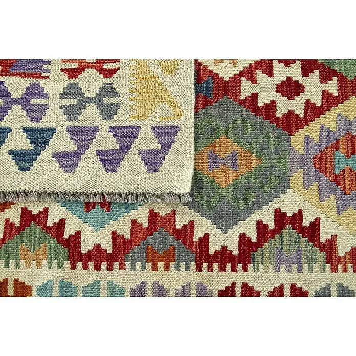 Alfombra de pelo corto Kilim Herat - Multicolor, 240 x 170 cm, 100% lana - Primer plano de una alfombra kilim colorida que muestra motivos geométricos y detalles de flecos.