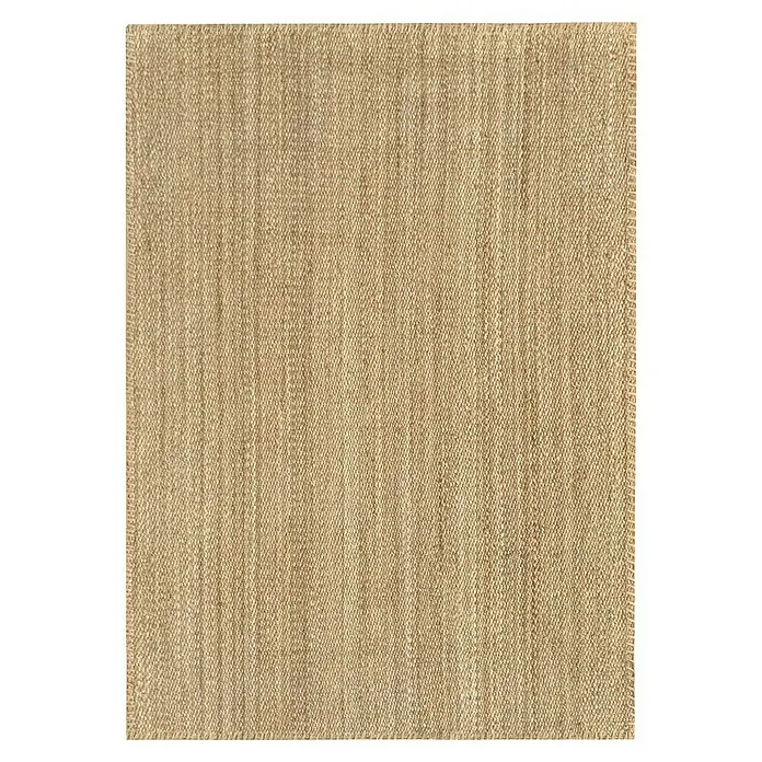 Alfombra de yute Córdoba - Natural, 230 x 160 cm, 100% yute - Vista detallada de una alfombra beige, mostrando su sutil textura, perfecta para agregar calidez y un ambiente acogedor a una habitación.