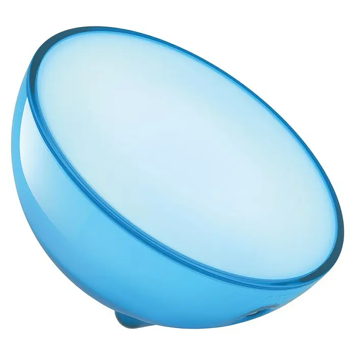 Philips Hue LED-Tischleuchte Go - 6 W, L x B x H: 15 x 15 x 7,9 cm, RGBW - Nahaufnahme einer modernen, blauen Tischleuchte mit sanftem, weißem Licht, ideal für stimmungsvolle Beleuchtung.