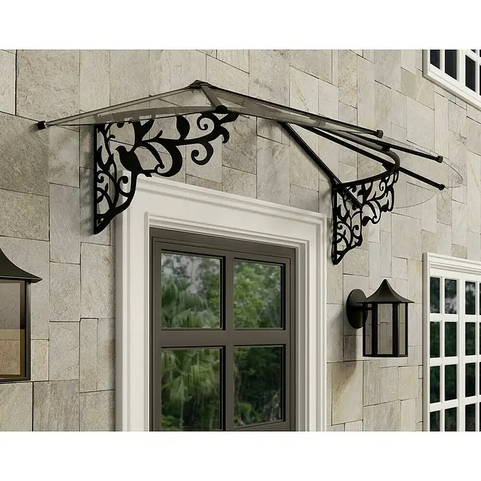 Palram – Canopia Marquesina para puerta Lily - 216 x 88 x 70 cm, Antracita - Imagen de un dosel decorativo para puerta de entrada con adornos negros de filigrana y un techo transparente.