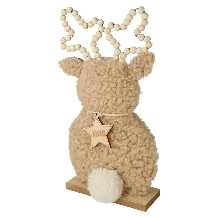 Dekofigur Hirsch - L x B x H: 13 x 5 x 24,5 cm, Braun/Grau, Holz, 1 Stk. - Beigefarbene, flauschige Rentier/Schaf-Weihnachtsdeko mit Holzperlen-Geweih, weißem Bommelschwanz und XMAS-Stern-Anhänger auf Holzsockel.