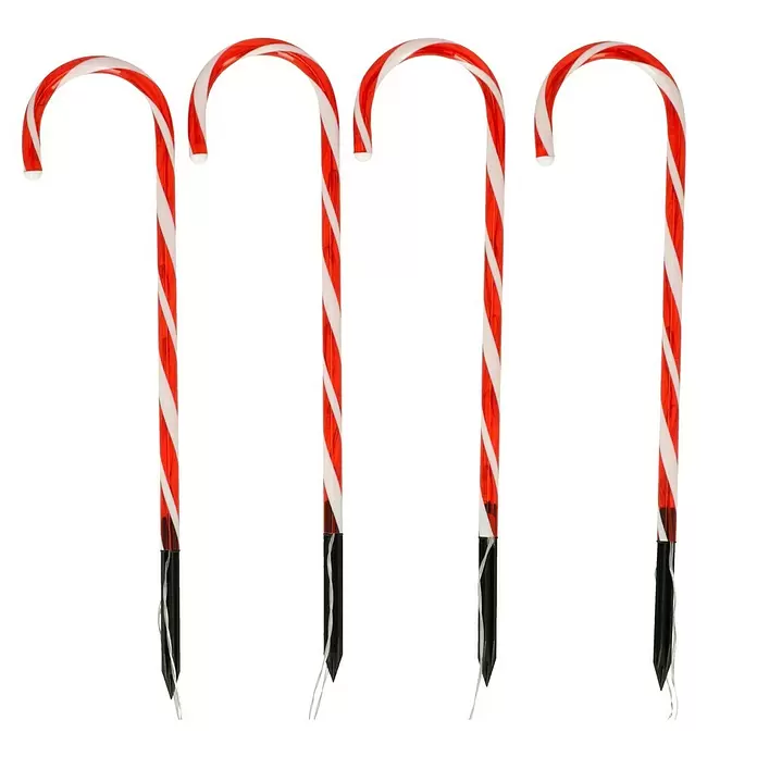 Tween Light LED-Gartenstecker Zuckerstangen - Innen, Lichtfarbe: Rot, Anzahl Leuchtmittel: 36 Stk., Batteriebetrieben - Vier rot-weiß gestreifte Zuckerstangen-Wegbegrenzungen mit schwarzen Erdspießen und weißen Kabeln.