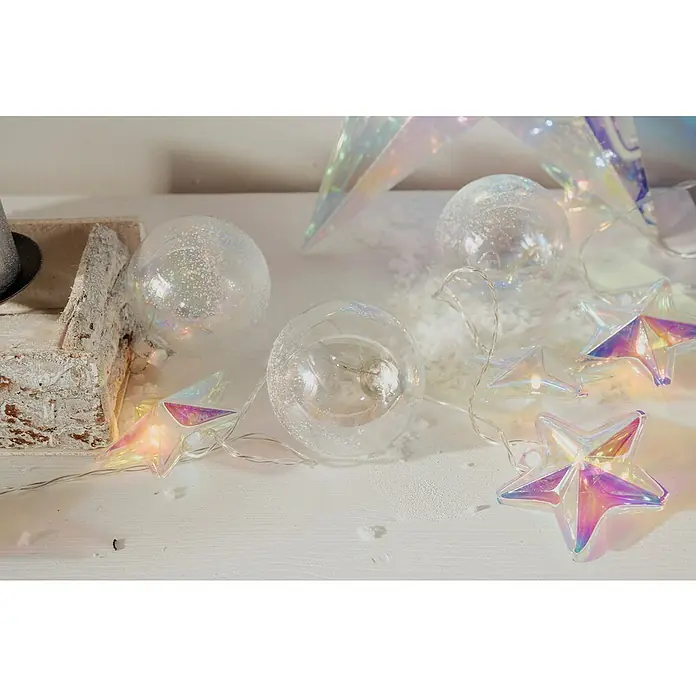 Tween Light Guirnalda luminosa LED de estrellas iridiscentes - Para interior, Color de luz: Blanco cálido, Número de bombillas: 10 ud., Funciona con pilas - Decoración navideña con bolas transparentes y luces de estrella creando un ambiente festivo y brillante.