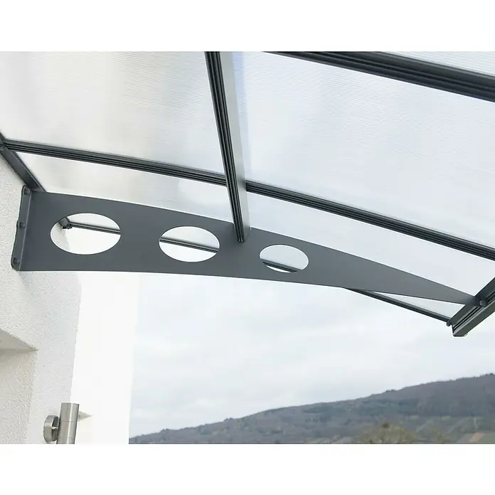 Palram – Canopia Marquesina para puerta Herald - 223 x 140 x 33 cm - Primer plano de un toldo de puerta de policarbonato gris con soportes de acero y recortes redondos en una fachada blanca.