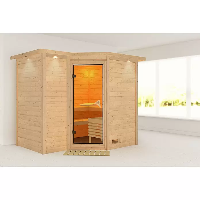 Karibu Massivholzsauna Sahib 2 - Ohne Ofen, Mit Dachkranz und Beleuchtung, L x B x H: 264 x 198 x 200 cm - Eck-Saunakabine aus hellem Naturholz mit Glastür, Bänken innen und Beleuchtung außen.