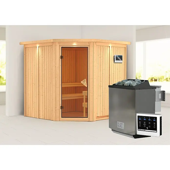 Karibu Elementsauna Jarin - Mit 9 kW Bio-Ofen mit externer Steuerung, Mit Dachkranz und Beleuchtung, Materialspezifizierung Tür: Ganzglas Bronze, L x B x H: 210 x 210 x 192 cm - Produktabbildung einer Ecksauna mit Holzverkleidung und einem Saunaofen mit Steinen und Bedienelement.