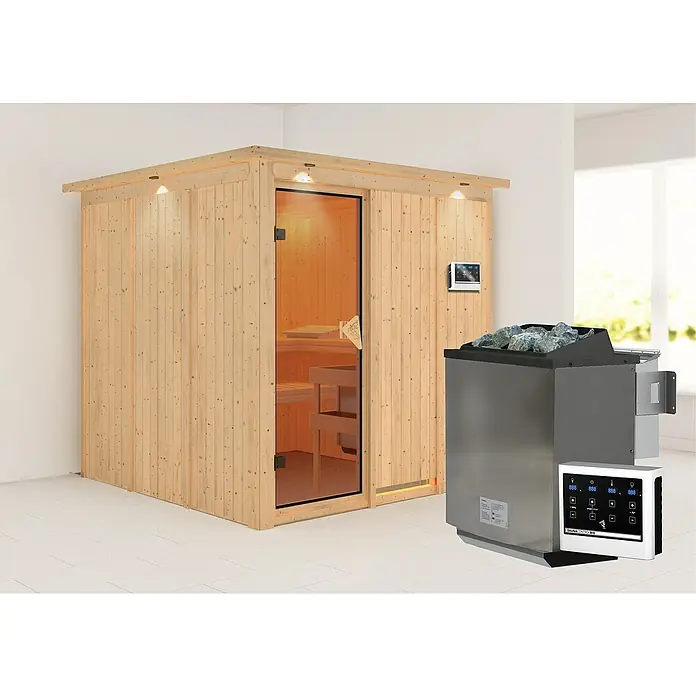 Karibu Elementsauna Rodin - Mit 9 kW Bio-Ofen mit externer Steuerung, Mit Dachkranz und Beleuchtung, L x B x H: 210 x 210 x 192 cm - Abbildung einer Sauna mit Holzwänden, einer Glastür und einem Ofen mit Steinen.