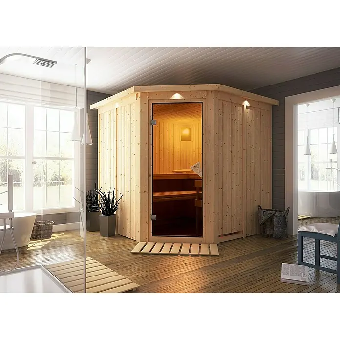 Karibu Elementsauna Jarin - Mit 9 kW Ofen mit integrierter Steuerung, Mit Dachkranz und Beleuchtung, Materialspezifizierung Tür: Ganzglas Bronze, L x B x H: 210 x 210 x 192 cm - Elegante Holzsauna mit Glasfront, integriert in ein modernes Badezimmerdesign für entspannende Wellnessmomente zuhause.