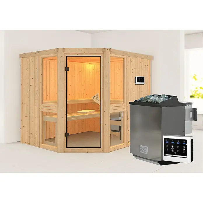 Karibu Elementsauna Amelia 3 - Mit 9 kW Bio-Ofen mit externer Steuerung, Ohne Dachkranz, L x B x H: 231 x 196 x 192 cm - Das Bild zeigt eine moderne Sauna mit Holzwänden, Glasfront und einem Saunaofen mit Steinen. Ein Bedienfeld zur Steuerung ist auch sichtbar.