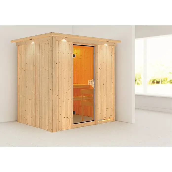 Karibu Elementsauna Bodin - Ohne Ofen, Mit Dachkranz und Beleuchtung, L x B x H: 210 x 165 x 192 cm - Holzsauna mit Glastür und eingebauten Bänken in einem hellen Raum. Die Sauna hat eine warme Beleuchtung und eine einladende Atmosphäre.
