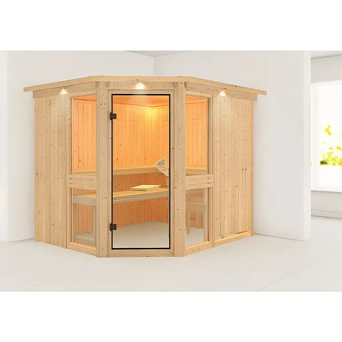 Karibu Elementsauna Amelia 3 - Ohne Ofen, Mit Dachkranz und Beleuchtung, L x B x H: 245 x 210 x 192 cm - Nahaufnahme einer Innensauna aus hellem Holz mit Glastür und Bänken. Die Sauna hat eine angenehme Beleuchtung und wirkt einladend.