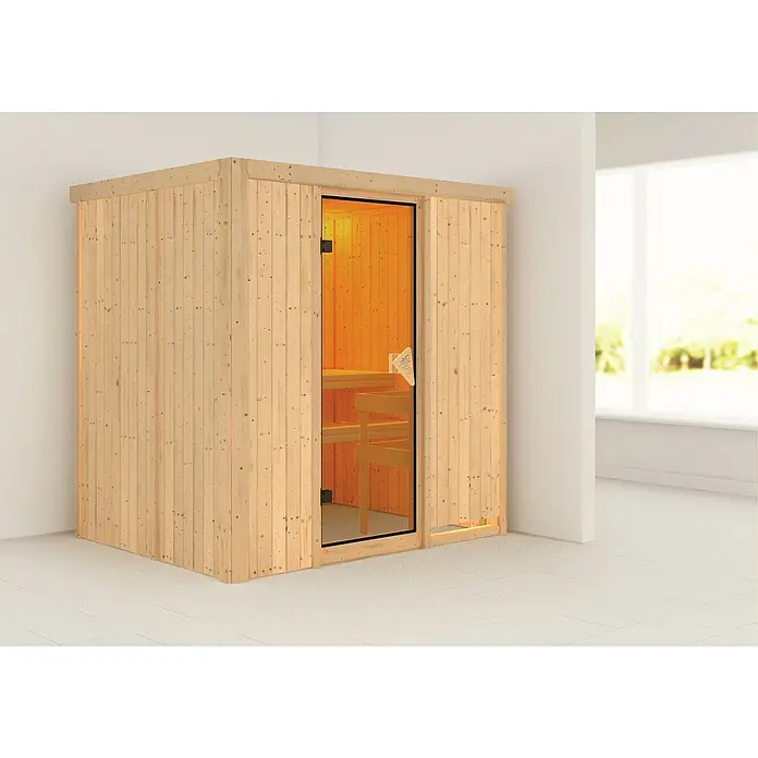 Karibu Elementsauna Bodin - Ohne Ofen, Ohne Dachkranz, L x B x H: 196 x 151 x 192 cm - Das Bild zeigt eine kompakte Holzsauna mit Glastür in einem hellen Raum. Die Sauna bietet Entspannung und Wärme für zu Hause.