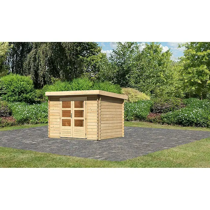 Karibu Gartenhaus Flora 3 - Außenmaß inkl. Dachüberstand (B x T): 297 x 237 cm, Holz, Natur - Ein Holzgartenhaus mit Doppeltür und Flachdach steht auf einer gepflasterten Fläche im Garten. Ideal für Gartengeräte oder als Stauraum.
