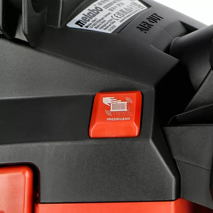 Metabo CAS 18V Akku-Nass-Trockensauger AS 18 HEPA PC Compact - 18 V, Ohne Akku, Behältervolumen: 6 l - Nahaufnahme eines Metabo-Geräts mit texturiertem dunkelgrauem Gehäuse und auffälligem rotem „PRESSCLEAN“-Knopf.