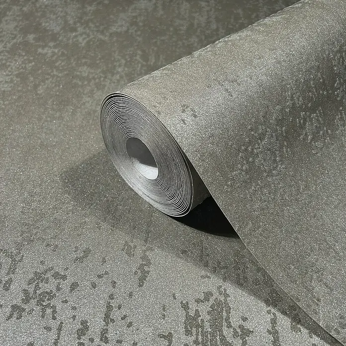 Marburg Eclectic Vliestapete Glasperlenstruktur - Braun, Metalloptik, 10,05 x 0,7 m - Ein Rollenbild der Tapete mit einem grauen Muster darauf. Das Muster erweckt einen eleganten und modernen Eindruck für jeden Raum.