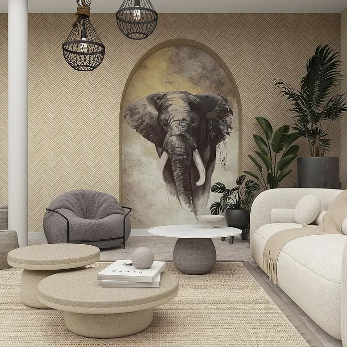 Marburg Travertino Vliestapete Fischgrätmuster - Beige, Holzoptik, 10,05 x 0,53 m - Ein stilvolles Wohnzimmer mit einem auffälligen Elefantenbild, einer gemütlichen Sitzecke und modernen Beistelltischen.