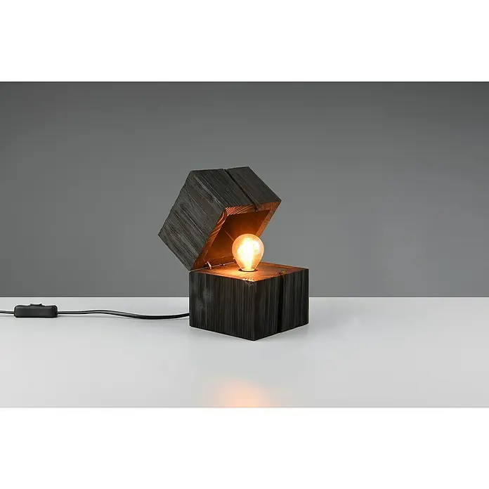 Trio Leuchten Deko-Tischleuchte - B x T x H: 12 x 12 x 16 cm, E14, Schwarz - Diese Aufnahme zeigt eine moderne Lampe in Würfelform mit einem aufklappbarem Deckel, die ein warmes, einladendes Licht spendet.