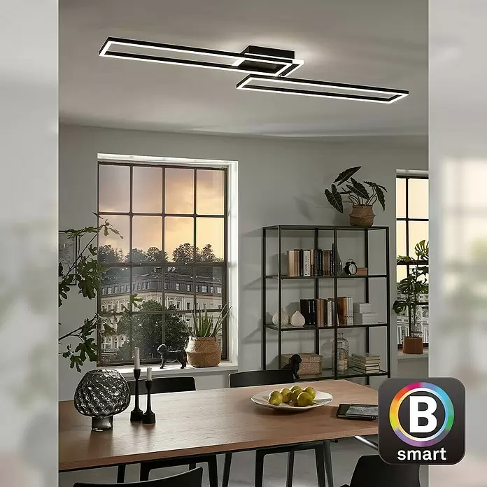 Brilo LED-Wand- & Deckenleuchte Frame S - 34 W, L x B x H: 110 x 24,8 x 7,8 cm, Schwarz, Warmweiß - Moderne schwarze rechteckige LED-Deckenleuchte beleuchtet einen Essbereich.