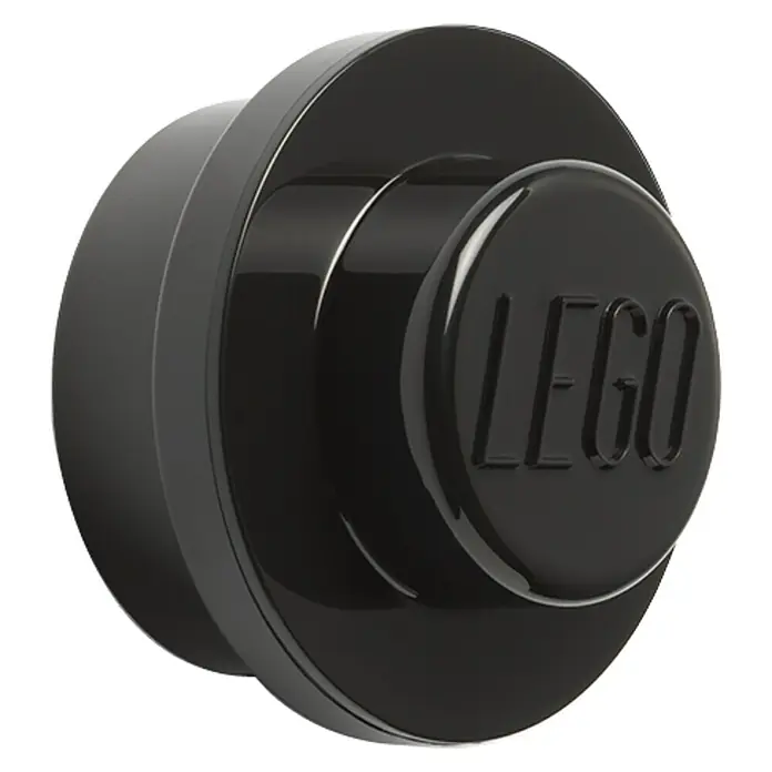 Lego Garderobenhaken - Swz, Grau, Weiß, 3 Stk. - Nahaufnahme eines schwarzen LEGO Noppensteins, der das LEGO Logo auf der Oberseite zeigt und die typische Bauweise des Spielzeugs hervorhebt.