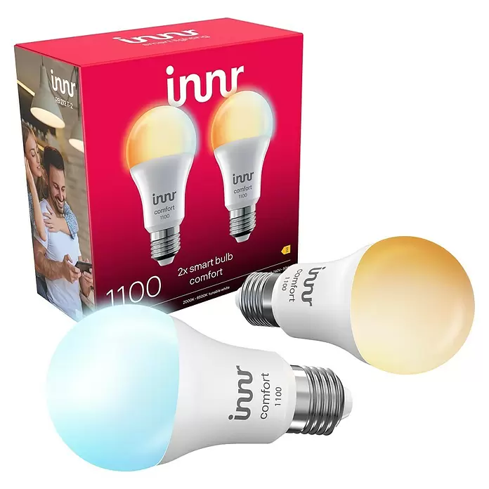 Innr Lighting Smart-LED-Lampe Bulb Comfort - E27, Dimmbar, Kaltweiß, 1.190 lm, 10,5 W, 2 Stk. - Innr comfort 2er Smart Bulb Pack mit zwei weißen, abstimmbaren LED-Lampen, eine kühlweiß, eine warmweiß leuchtend, neben einer roten Box.