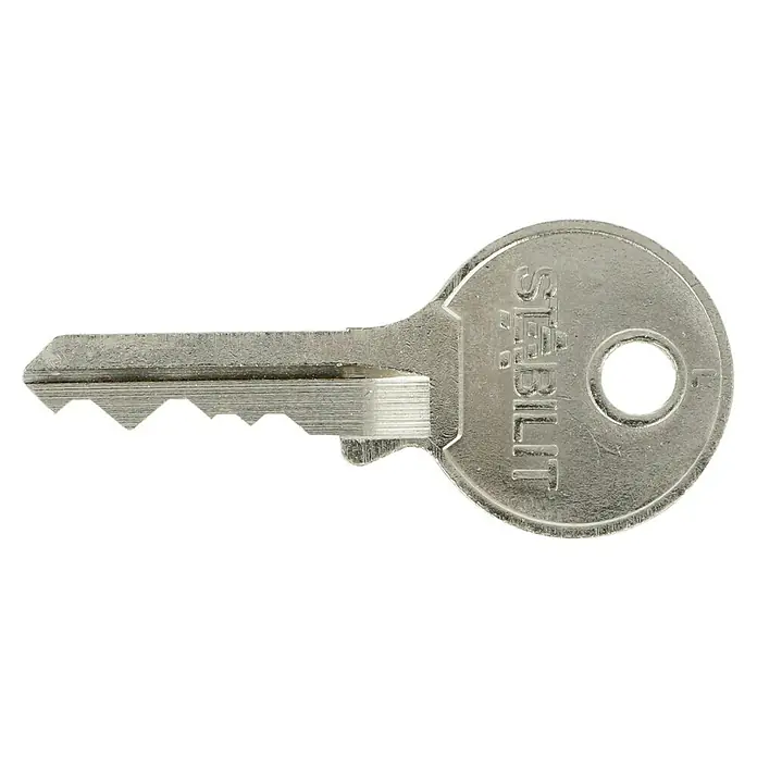 Stabilit Vorhängeschloss M40 - Breite: 40 mm, Bügelstärke: 6,3 mm - Nahaufnahme eines silberfarbenen Stabilit Schlüssels vor einem schwarzen Hintergrund, der die Details und die Marke hervorhebt.