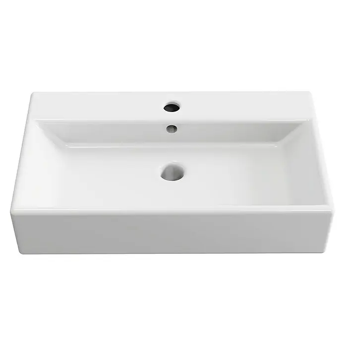 Artysan Lavabo de sobremesa Recto - 60,9 x 36,2 cm, Blanco - La imagen muestra un lavabo rectangular de cerámica blanca con tres agujeros para grifo y desagüe, ideal para diseños de baño contemporáneos.