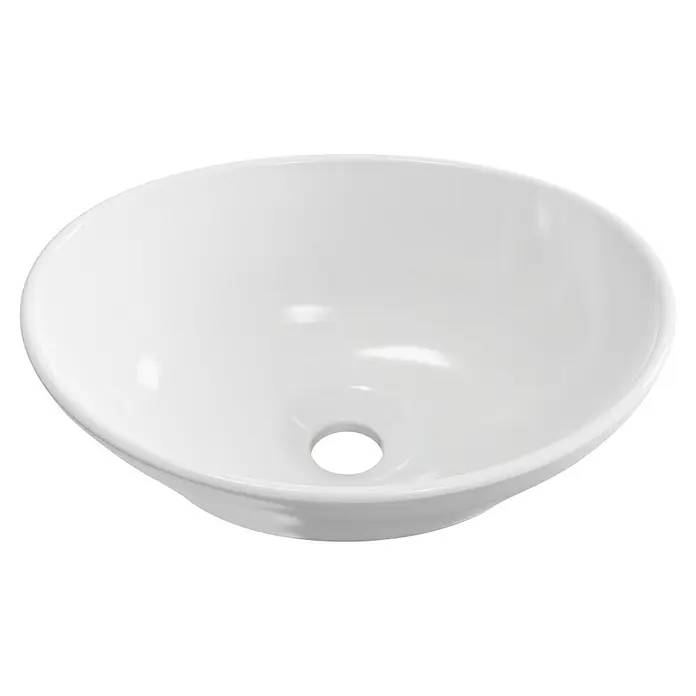 Artysan Lavabo de sobremesa Danae - 41,2 x 31,7 cm, Blanco - Un lavabo de cerámica blanca con un diseño redondo y un orificio de drenaje en el centro.