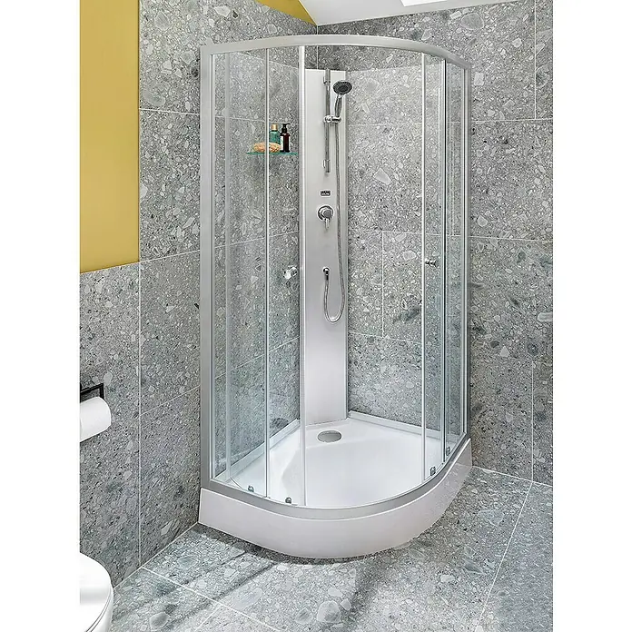 Aurlane Komplettdusche White Sea - 90 x 90 x 210 cm, Weiß/Grau - Aufnahme einer modernen, abgerundeten Duschkabine mit Glaswänden und silbernen Rahmen vor einer grauen, gesprenkelten Badezimmerfliese.