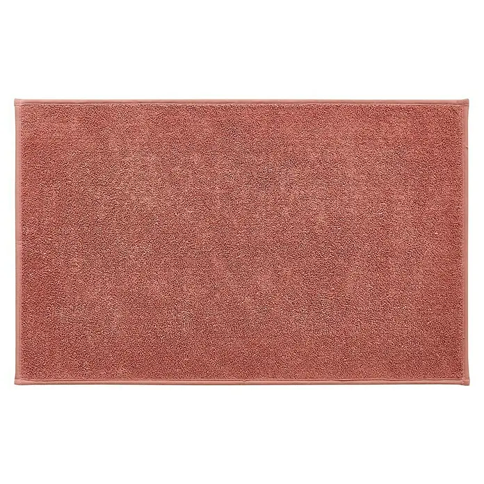Badteppich Malibu - 60 x 100 cm, Rostrot, 100% Polyester - Nahaufnahme einer rechteckigen, korallenroten Badematte mit einem schlichten, farblich abgestimmten Rand, ideal für jedes Badezimmer.