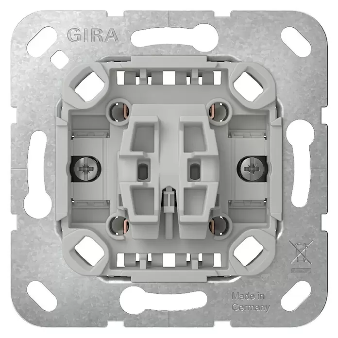 Gira Kreuzschalter-Einsatz 310700 - 10 A, Unterputzmontage - Rückansicht eines grauen GIRA Schaltereinsatzes mit Metallrahmen und Schraubklemmen zur Verdrahtung.