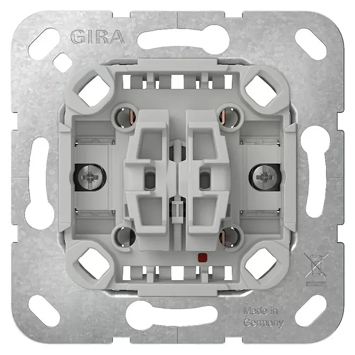 Gira Serienschalter-Einsatz 310500 - 10 A, Unterputzmontage - Gira Lichtschaltereinsatz, Rückansicht. Hellgrauer Kunststoffmechanismus mit Metallrahmen und Anschlussklemmen.