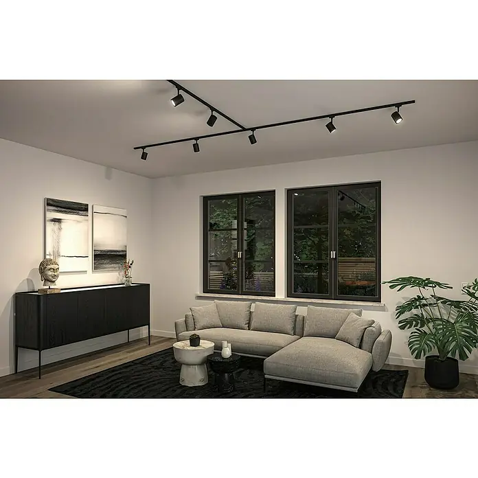 Paulmann URail LED-Spot Luxe10 W, Schwarz matt, 6,5 x 9 x 16,3 cm - Ein stilvolles Wohnzimmer mit einer modernen schwarzen Schienenleuchte an der Decke, die den Raum optimal beleuchtet.