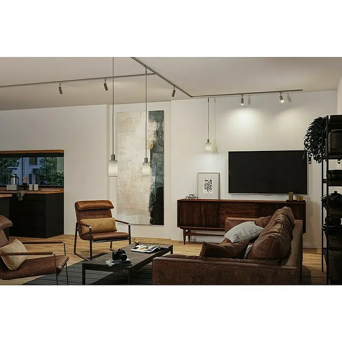 Paulmann URail Lampenschirm Valerio - E27, Grau, Ø x H: 10 x 18 cm - Eine moderne Wohnzimmer-Szene mit fokussiertem linearen Beleuchtungssystem, das Eleganz und Funktionalität verbindet.