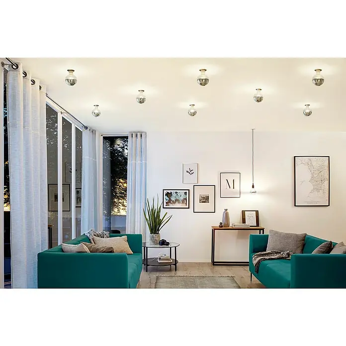 Paulmann LED-Lampe Modern Classic Edition - Dimmbar, Warmweiß, 600 lm - Elegantes Wohnzimmer mit türkisfarbenen Sofas und stilvollen Deckenleuchten, die eine warme Atmosphäre schaffen.