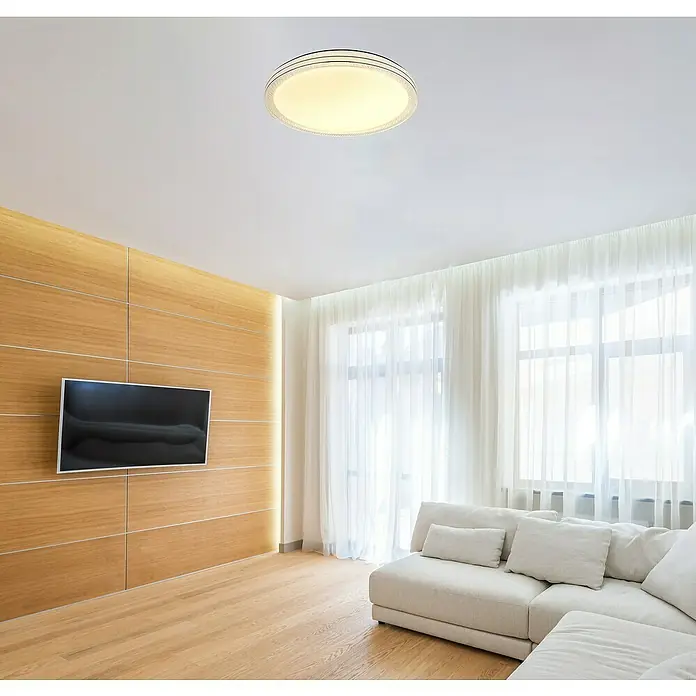 Globo LED-Deckenleuchte rund Veleno Sparkle - 24 W, Ø x H: 49 x 7 cm, Weiß, Warmweiß - Ein heller, runder Deckenleuchter mit feinen Details an der Decke eines modern eingerichteten Wohnzimmers.
