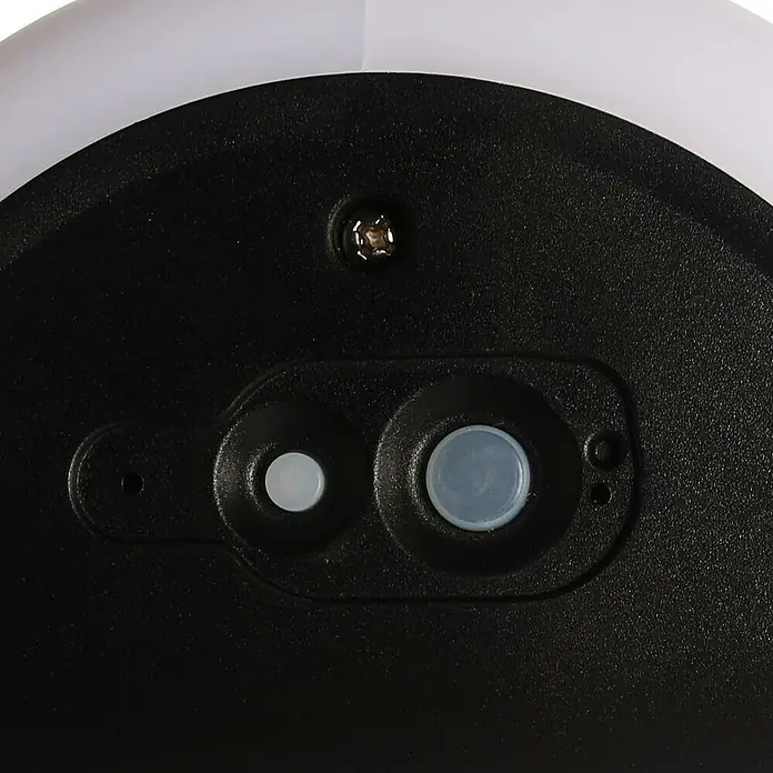 Baliza exterior LED solar Denia - 3 W, Blanco neutro - Primer plano de la parte inferior de un dispositivo con botones redondos y un tornillo, destacando los componentes.
