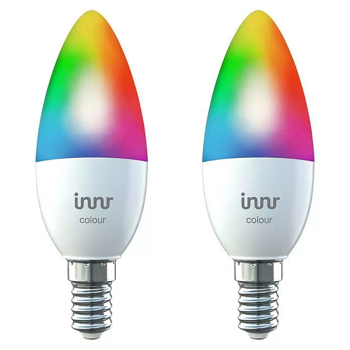 Innr Lighting Smart-LED-Lampe Candle Colour - E14, Dimmbar, RGBW, 465 lm, 4,9 W, 2 Stk. - Zwei smarte Innr Farb-LED-Kerzenlampen, weiß mit metallischem Schraubsockel, strahlen ein lebendiges Regenbogenlicht aus.