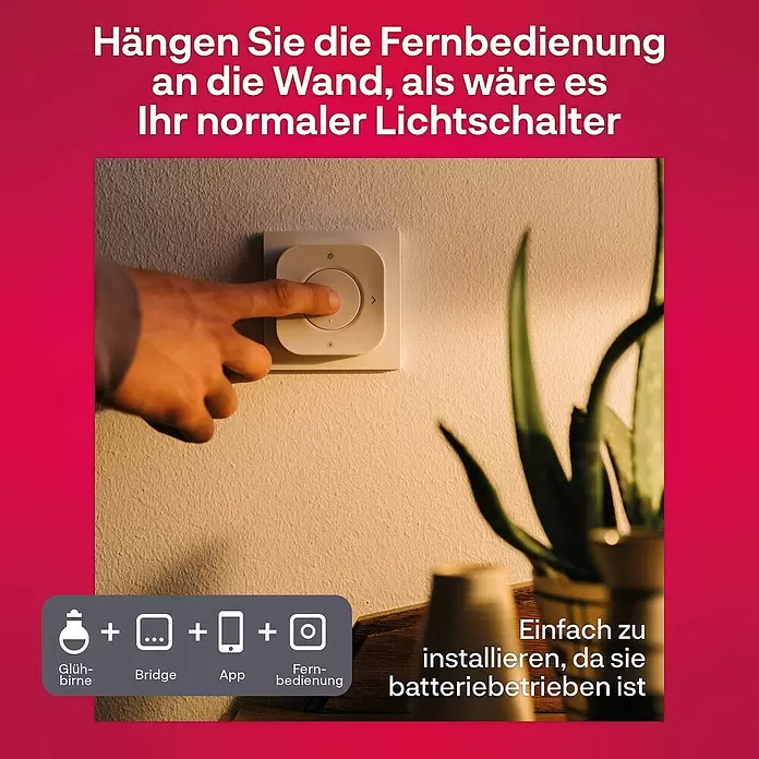 Innr Lighting Dimm- & Schaltcontroller Remote kabellose Steuerung - Weiß - Eine Hand drückt eine weiße, batteriebetriebene Smart-Home-Fernbedienung an der Wand, die als Lichtschalter fungiert.