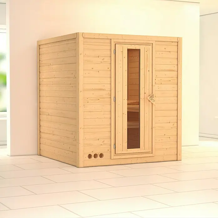 Karibu Elementsauna Mojave - Ohne Ofen, Ohne Dachkranz, Materialspezifizierung Tür: Massivholztür, L x B x H: 196 x 196 x 192 cm - Eine moderne Holzsauna mit Glastür steht auf hellen Fliesen und verspricht Entspannung und Wohlbefinden im eigenen Zuhause.