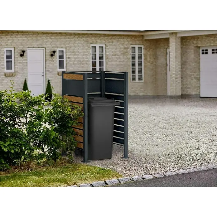 Metzler Mülltonnenverkleidung - 85 x 85 cm, Stahl, Anthrazit/Braun, Geeignet für Anzahl Mülltonnen: 1 Stk. - Diese Aufnahme zeigt eine moderne Mülltonnenbox mit Lattenmuster. Sie schützt die graue Mülltonne und fügt sich in die Hausfassade ein.