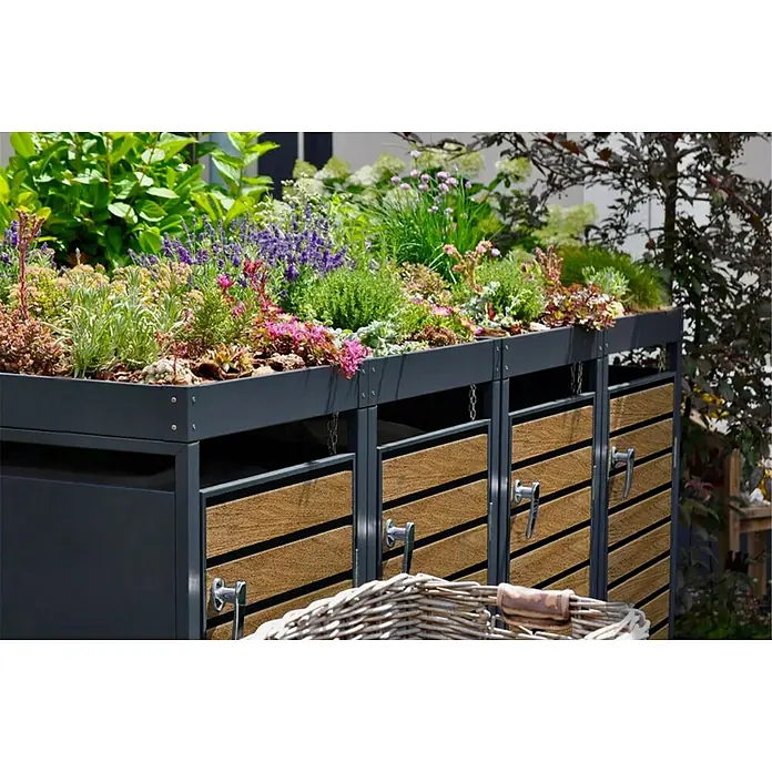 Metzler Mülltonnenbox - 326 x 80 cm, Stahl, Anthrazit/Braun, Geeignet für Anzahl Mülltonnen: 4 Stk., Mit Pflanzdach - Grüne Mülltonnenbox mit bepflanztem Dach, das als kleiner Garten dient. Die Box ist aus grauem Metall und Holz gefertigt.