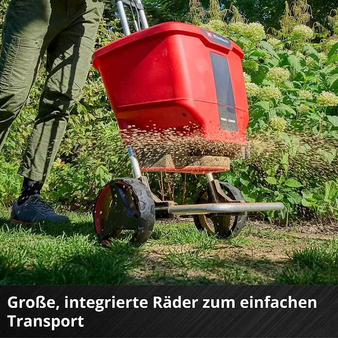 Einhell Power X-Change 18V Streuwagen GE-SR 18/22 - Akkubetrieben, Arbeitsbreite: 600 cm, 22 l - Roter Streuwagen mit großen Rädern, der Granulat auf Rasen verteilt.
