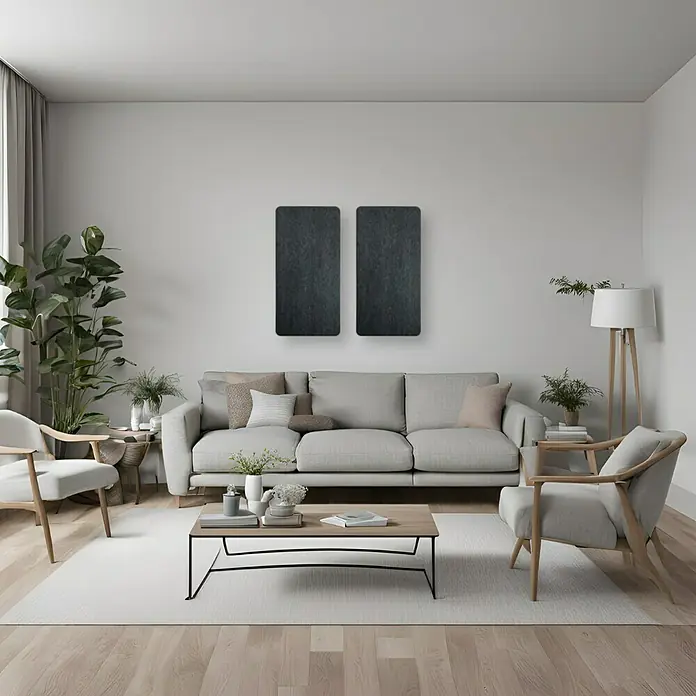 Silenti Akustikpaneel - 2 Stk., Anthrazit, 100 cm x 50 cm x 50 mm - Einrichtungsidee für Wohnzimmer mit grauem Sofa, zwei Sesseln und minimalistischem Couchtisch, betont durch dunkle Wanddekorationen.