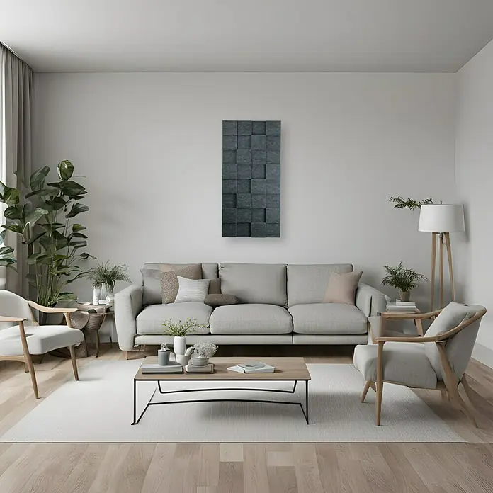 Silenti Akustikpaneel CubeLevel - Anthrazit, 116 cm x 58 cm x 80 mm, 100 % Polyester - Das Wohnzimmer zeigt ein graues Sofa mit grauem 3D Wandpaneel darüber, einen Couchtisch und zwei Stühle auf einem hellen Teppich.