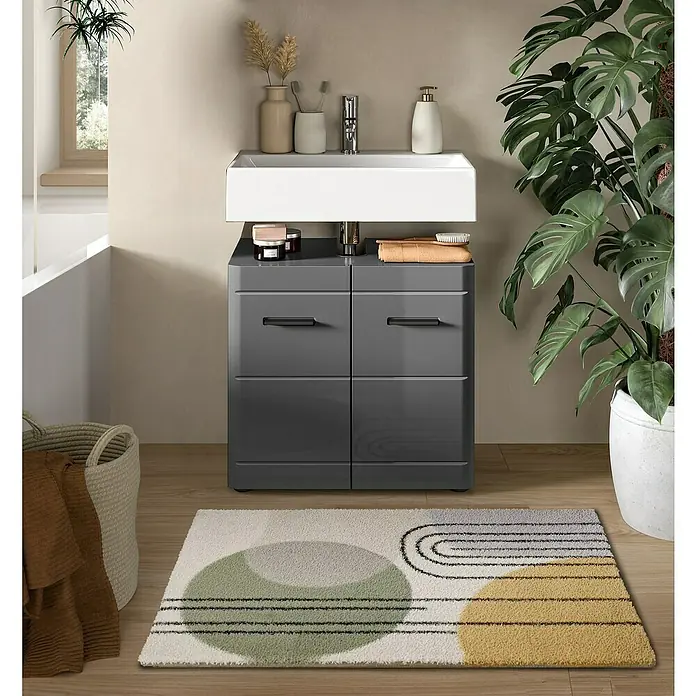 xonox.home Soft Waschtischunterschrank - B x T x H: 60 x 34 x 56 cm, Grau, Glänzend - Ein moderner grauer Waschtischunterschrank mit einem weißen Aufsatzwaschbecken und einer gemusterten Badematte im Badezimmer.