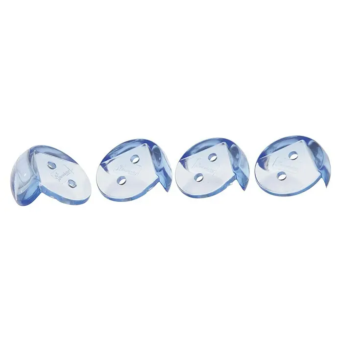 Dreambaby Eckenschutz - Farblos, 4 Stk. - Vier blaue Eckenschutzelemente im Detail, die Ecken von Möbeln schützen und Verletzungen vorbeugen sollen.